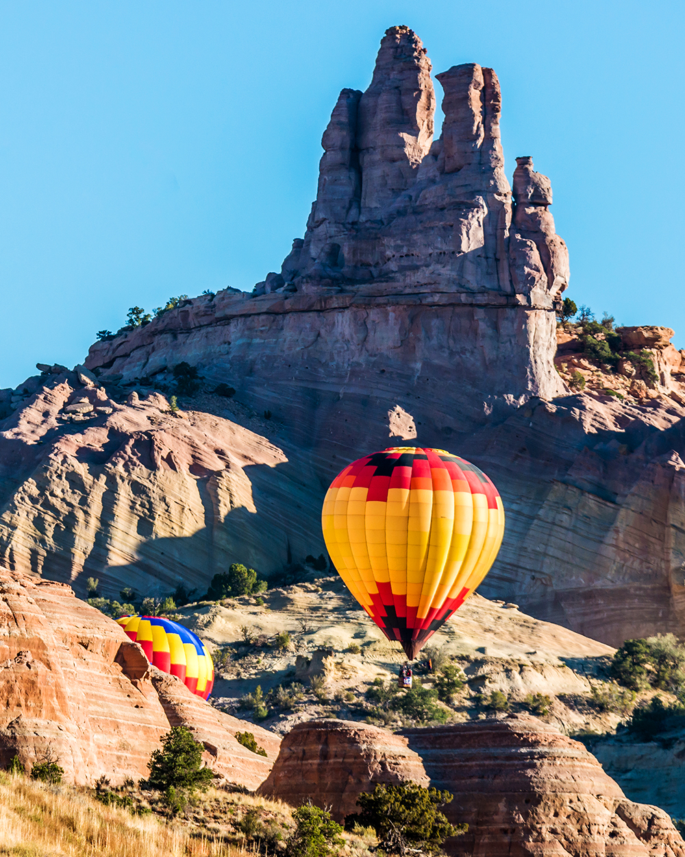 HCSC- Hot air balloons flight over Castle Rock the which Red Rock Canyon near Gallup, New Mexico.